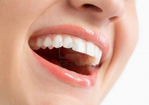 4354239-woman-smiling-with-great-teeth-on-white-background-300x213